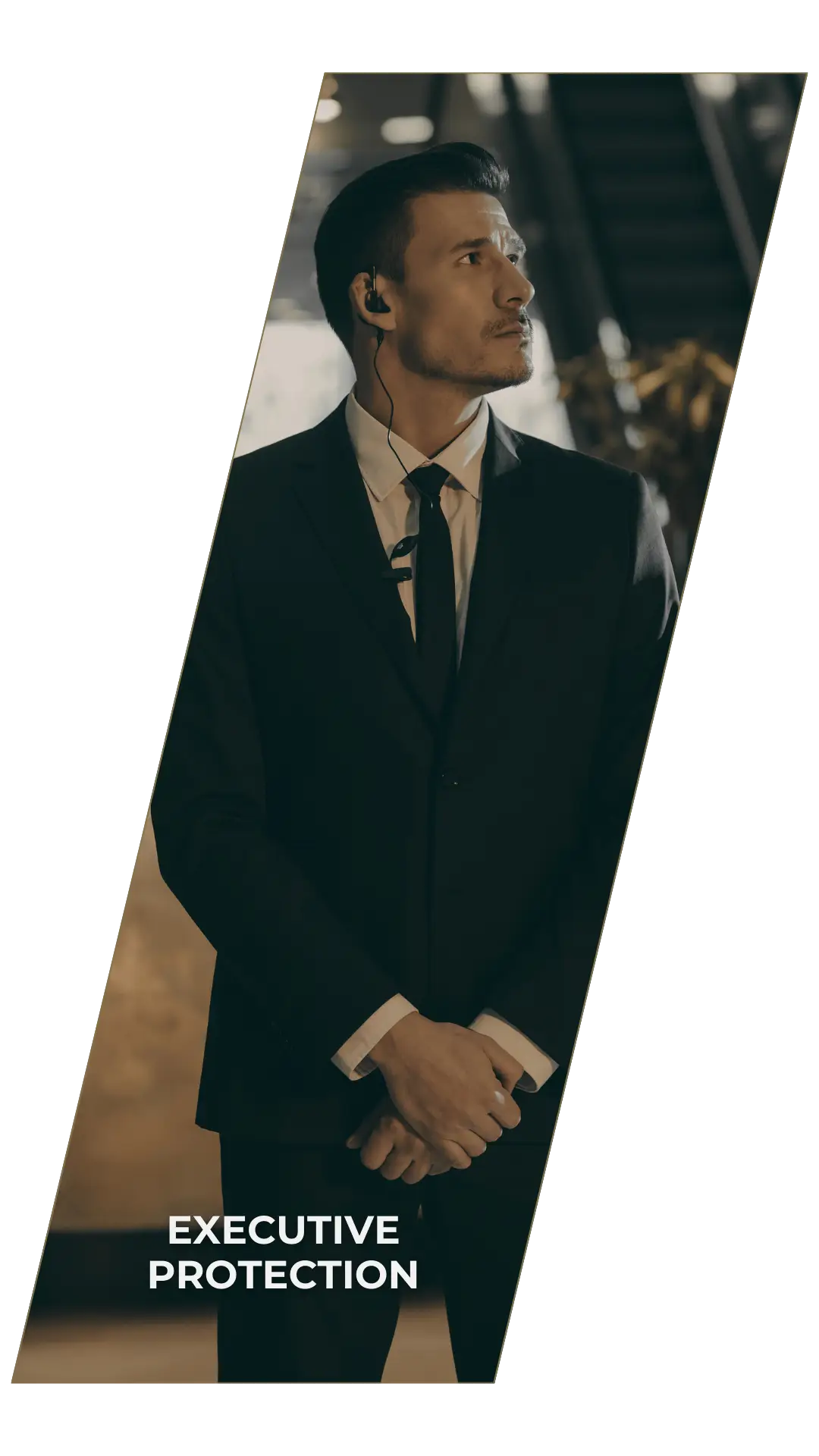 Executive protection services represented by a professional bodyguard in a suit.